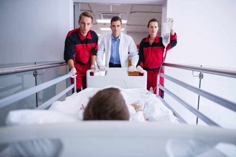 Young doctor treating a patient in an emergency department, illustrating early specialisation in Emergency Medicine