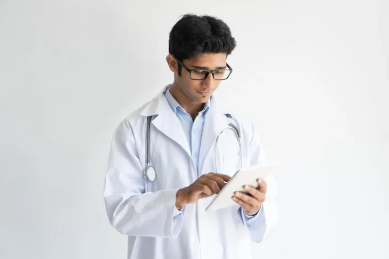 Indian doctor reviewing specialisation pathways for career advancement in 2025, reflecting emerging medical fields and clinical upskilling options.