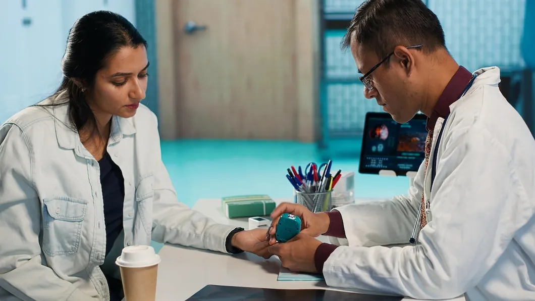 General physician reviewing diabetes management plan with a patient in a clinical setting